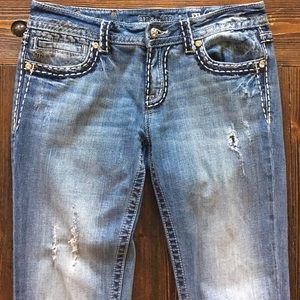 light wash distressed Miss Me boot cut jeans