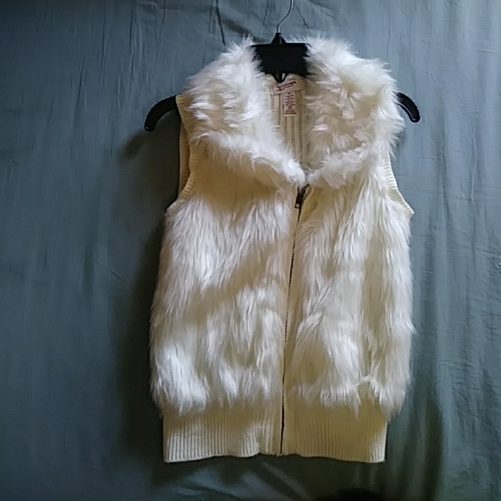 White fur vest