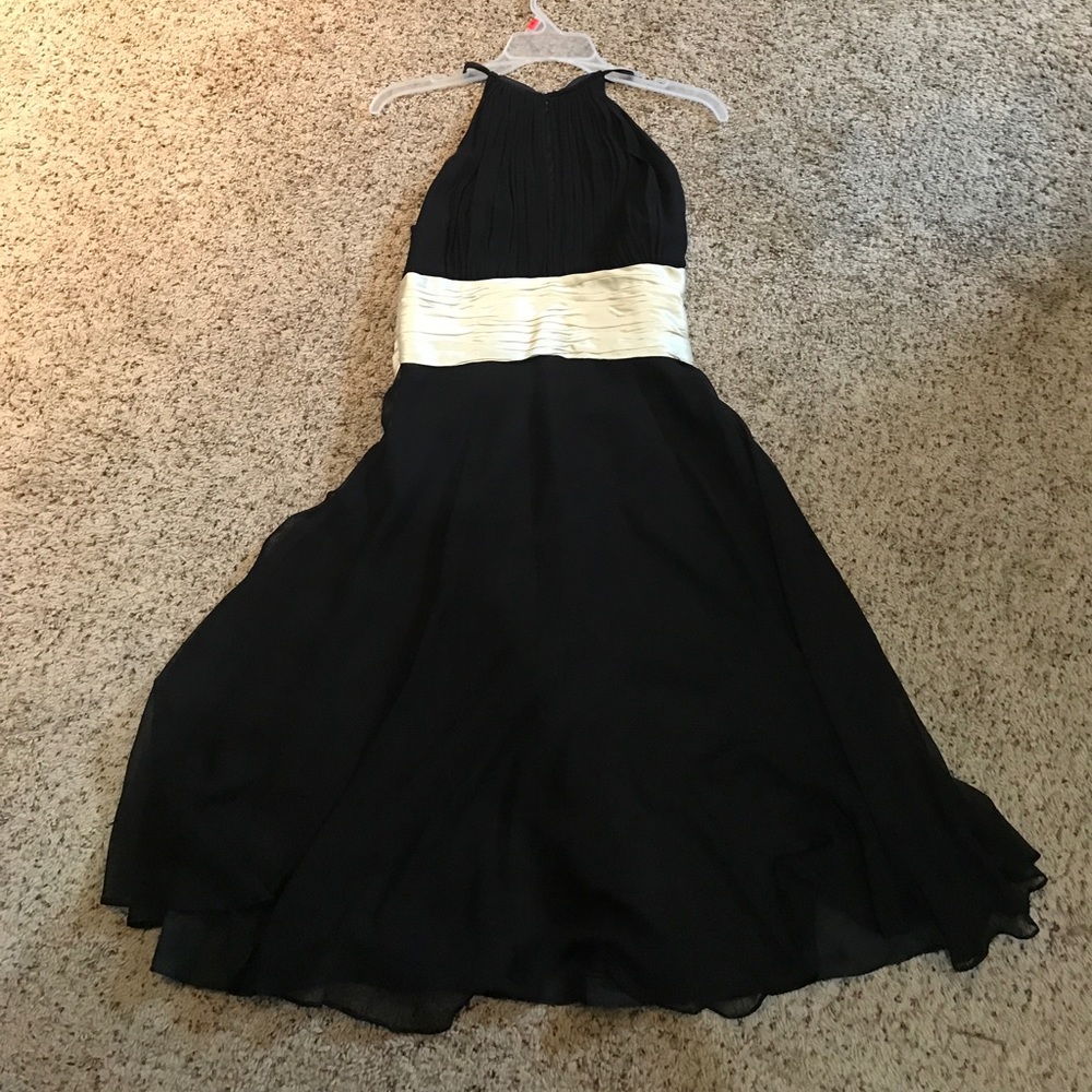 Black cocktail dress with wide cream colored sash