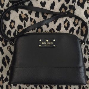 Black cross body bag, with hot pink interior