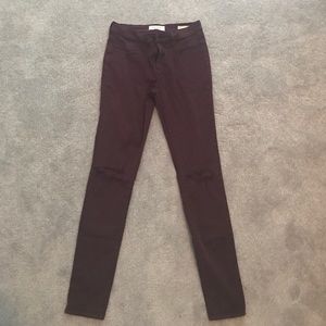 Burgundy distressed skinny jeans