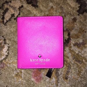 Kate Spade fuchsia mini wallet.