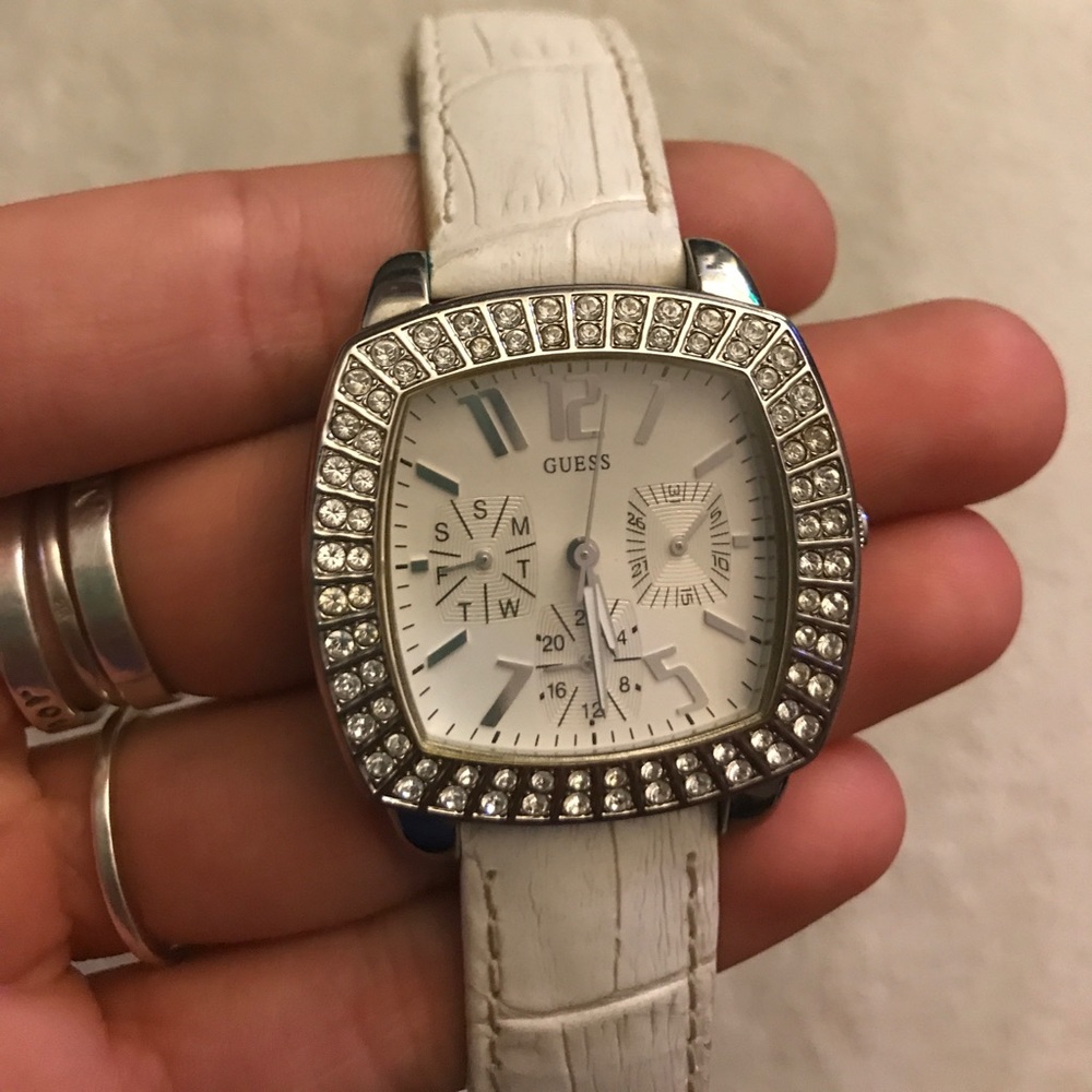 GUESS white leather water resistant watch.