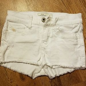 White distressed denim shorts