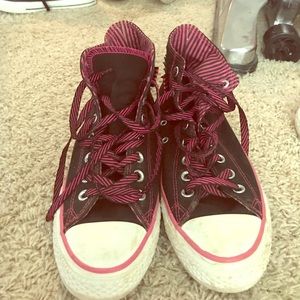 Black and pink high top converse