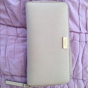 Cream Kate Spade wallet.