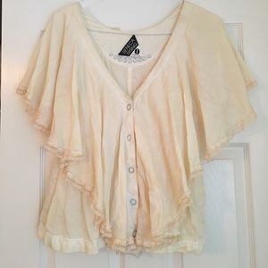 Pale pink flowy top with lace accents