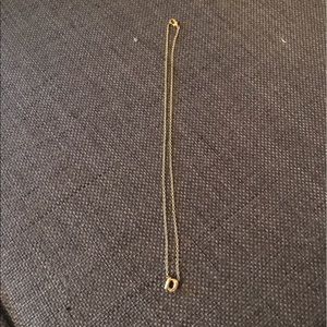 Lowercase "a" pendant necklace