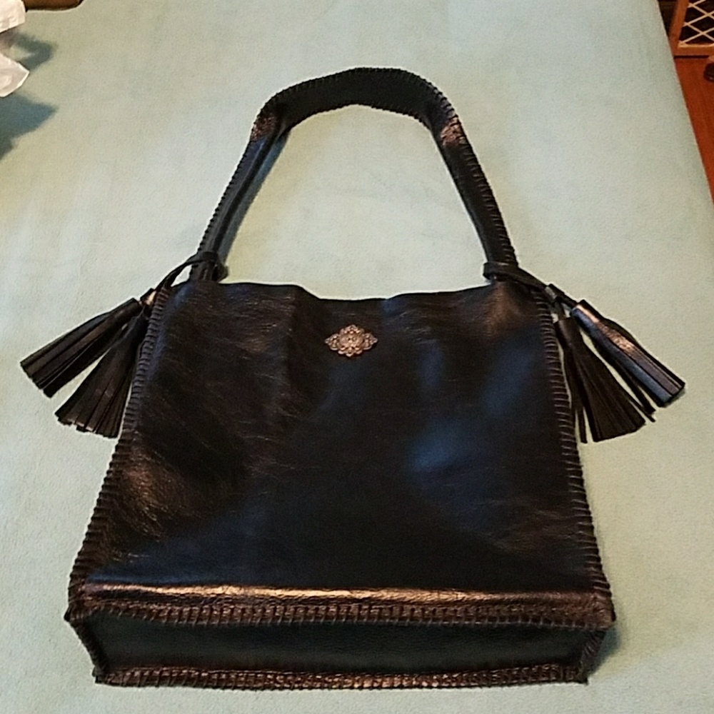 Hand made and stiched black leather purse