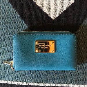 Blue Michael Kors wristlet.