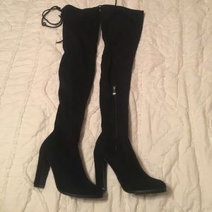 Thigh high heeled boots