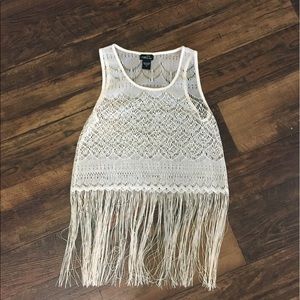 Crocheted tank with fringe at the bottom.