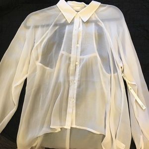 Sheer white blouse with cut out design on back