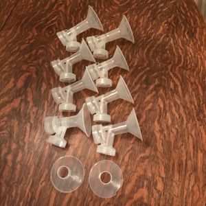 Eight Medela breast pump accessory units