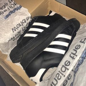 all black superstar adidas