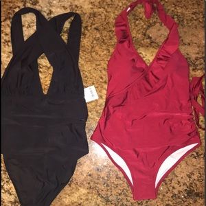 Black bathing suit size S. red bathing suit size M