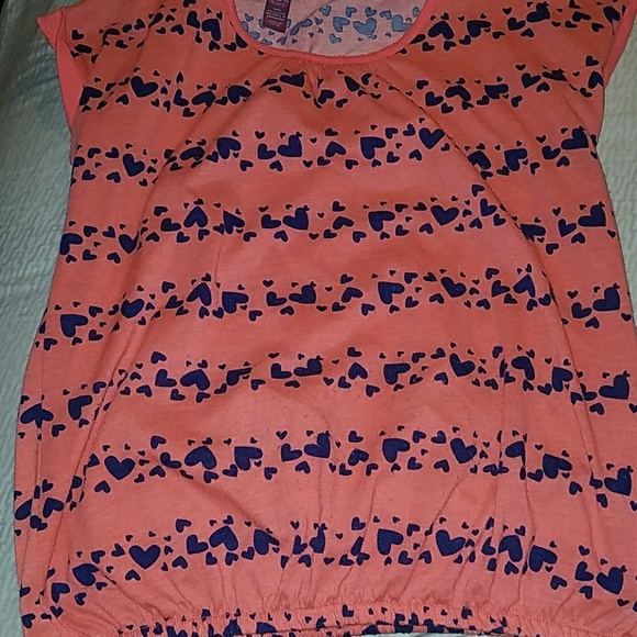 Orange Short Sleeve Shirt. Blue hearts all over