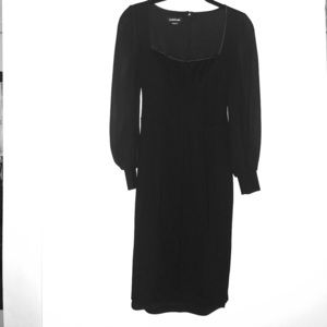 Black slim fitting dress with sheer long sleeves