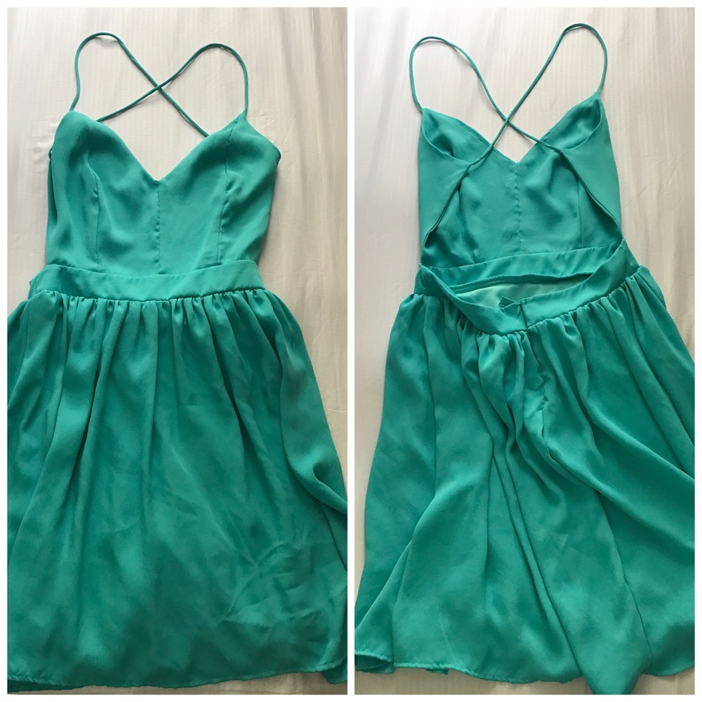 Teal open back dress.