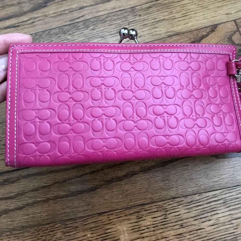 Pink coach wristlet. leather with cc emboss logo