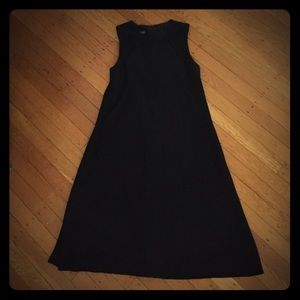 A line black dress, with modest little cut outs