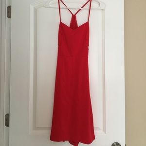 Red party dress with lace back and cutout detail