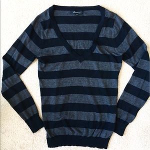 Black and grey striped v-neck sweater