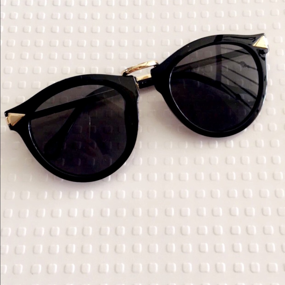 Black framed sunglasses with black lens