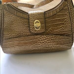 Strata Leather look w/ wallet hidden on outside.