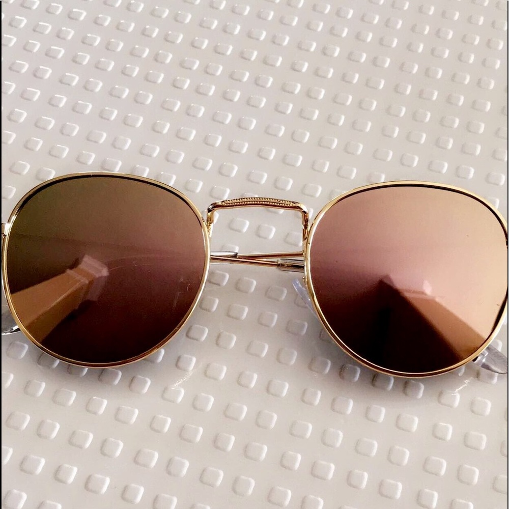 Gold framed sunglasses