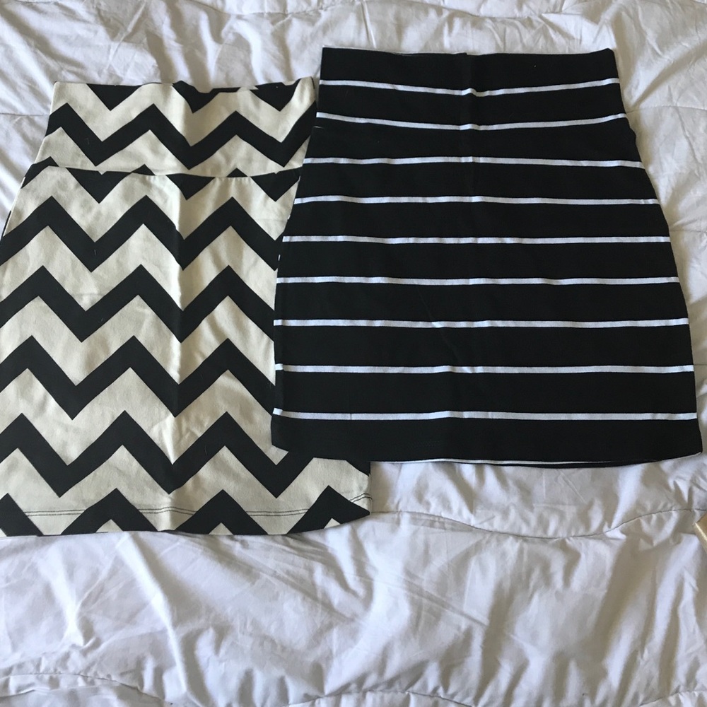 Two black and white mini skirts