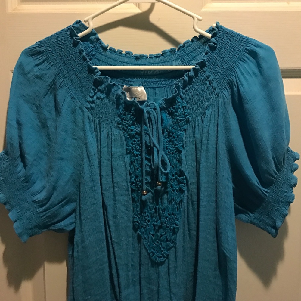 Turquoise tunic with crochet detail