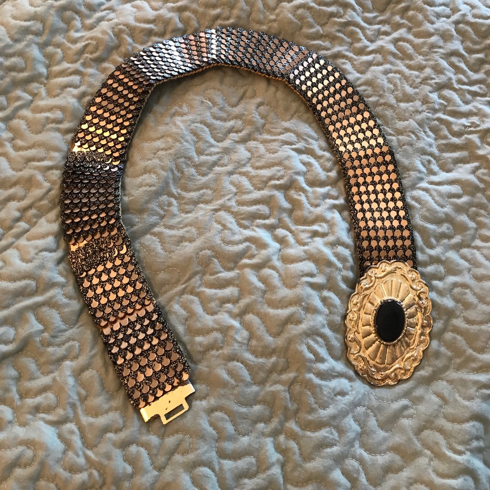 Gold and black belt with large buckle