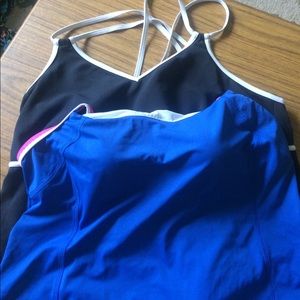 Two tankini bathing suit tops