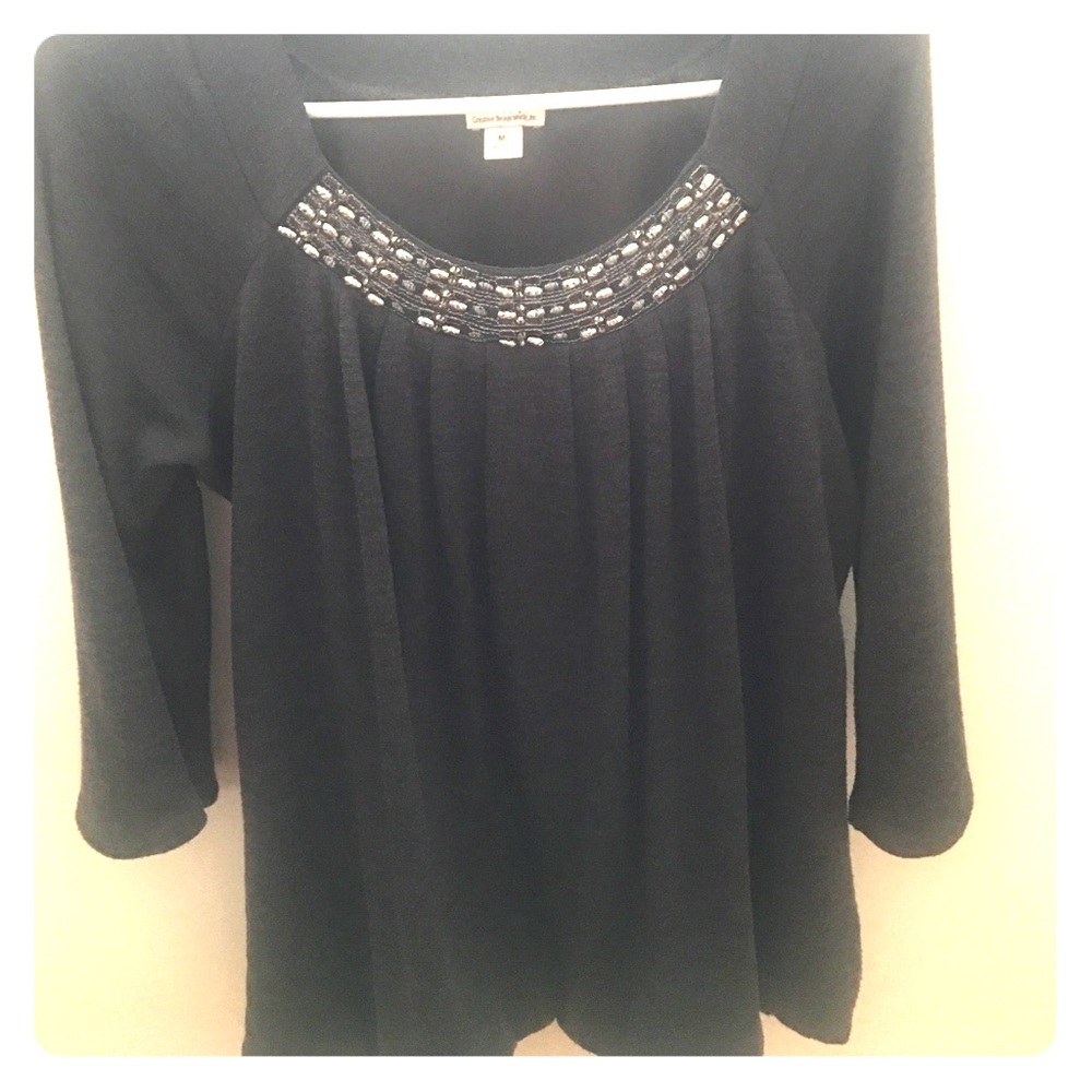 Jewel neck lined blouse.
