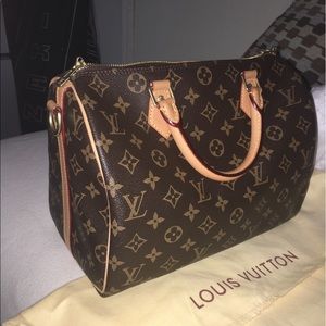 LV Speedy 30 with shoulder strap.