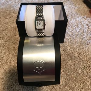 Stainless steel. Never worn. women's.