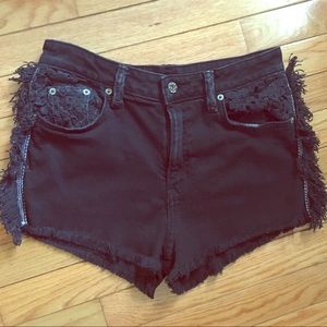 Black denim shorts with frayed edges & inset lace