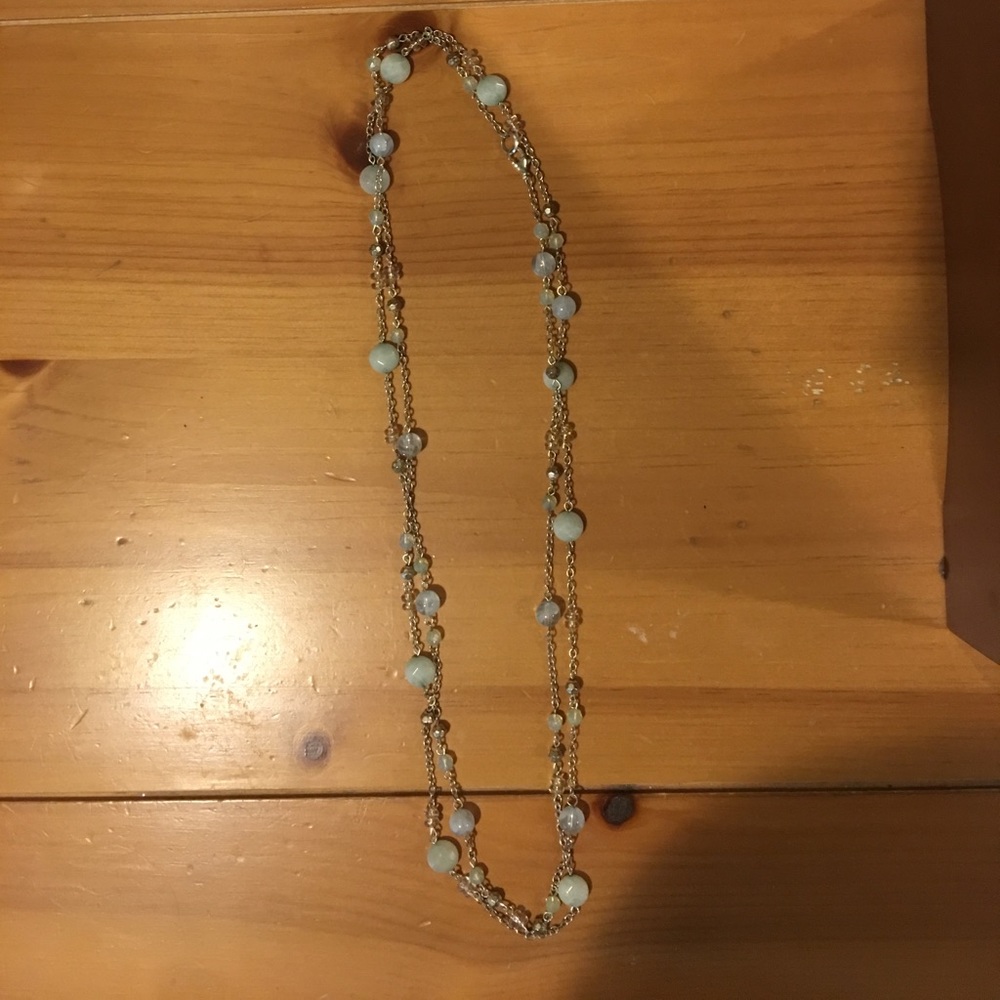 Silver strand necklace with blue and green beads