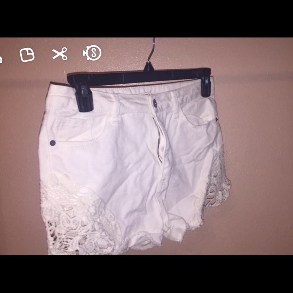 White denim shorts with lace trimming