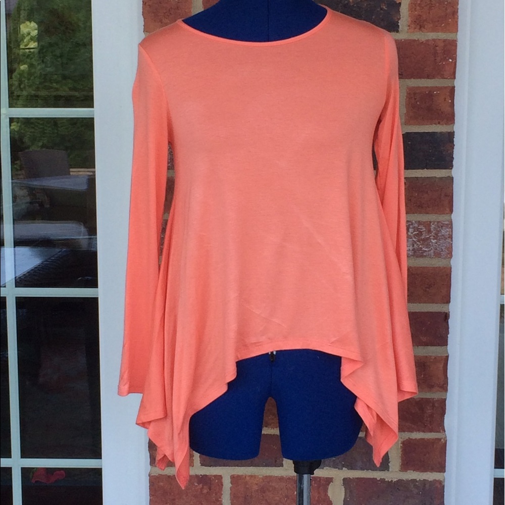A peach colored Soprano shirt that is ultra soft.