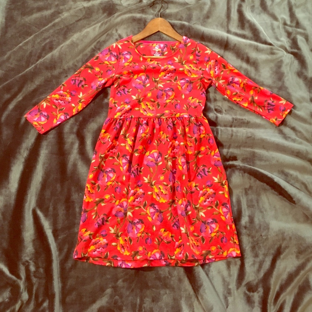A Girls red dress with roses