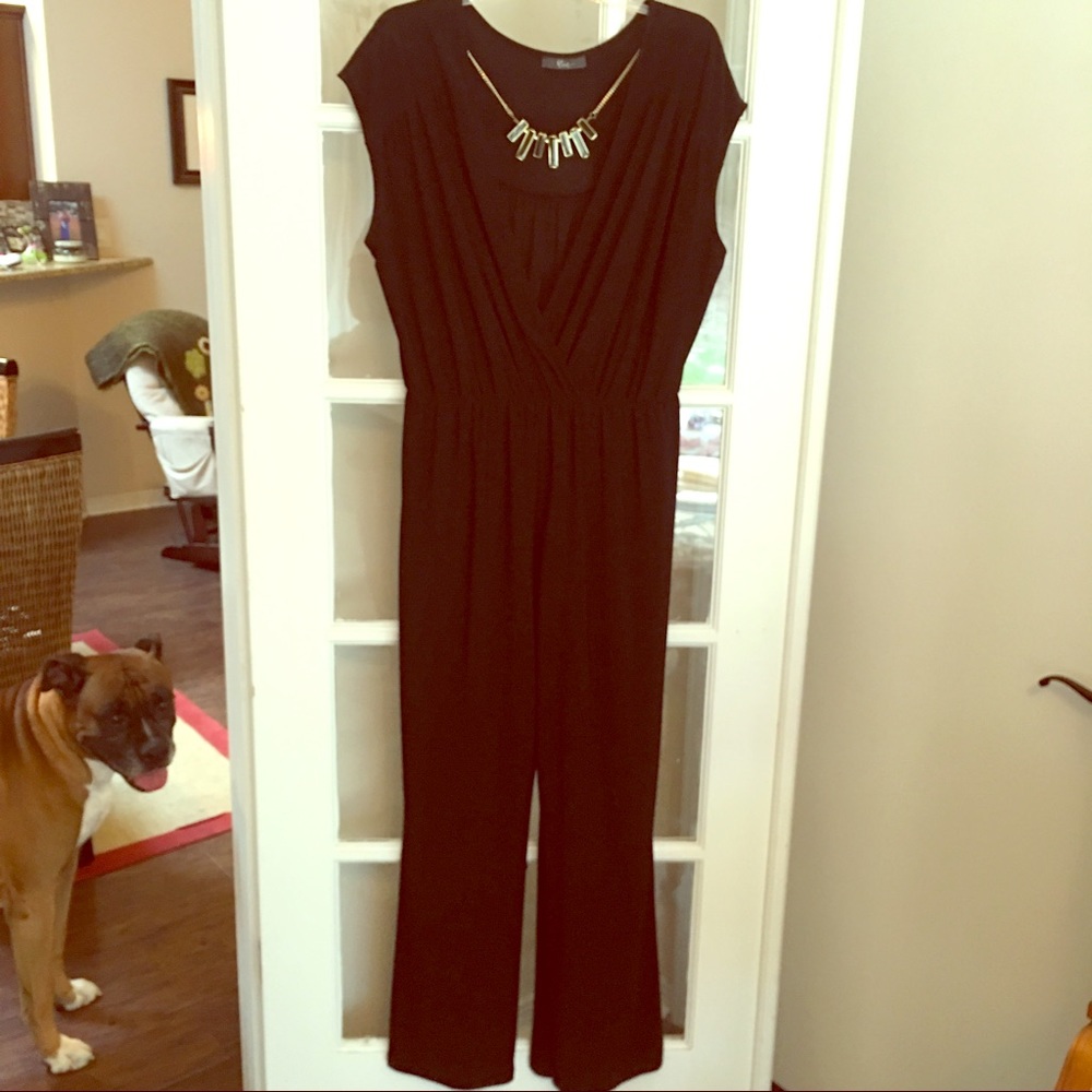 Sleek black romper with attached necklace!