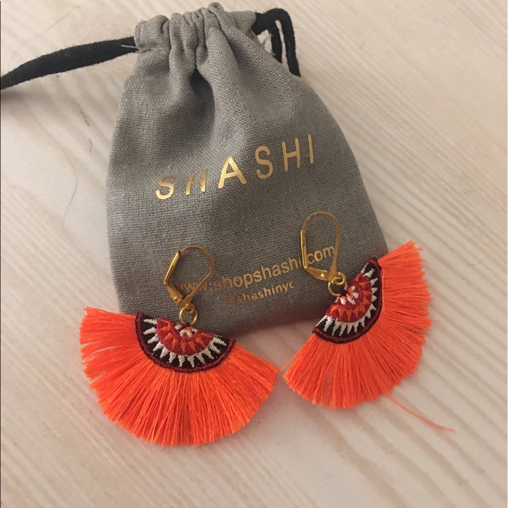 Shashi Shannon orange tassel earrings