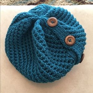 Teal crocheted beanie with wooden buttons