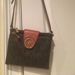 Cross body Michael Kors purse.