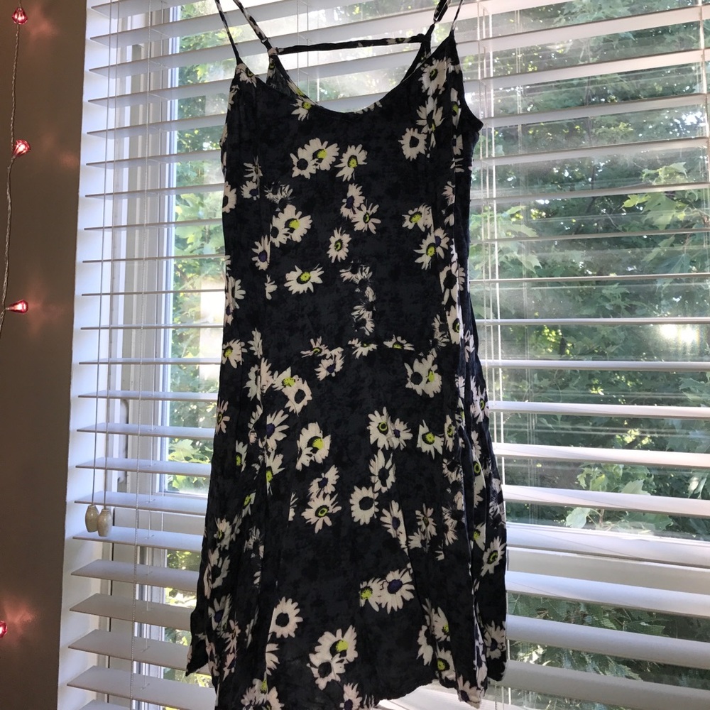 a cute little dark blue sundress with daisies.