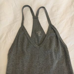 OUT FROM UNDER GRAY TANK