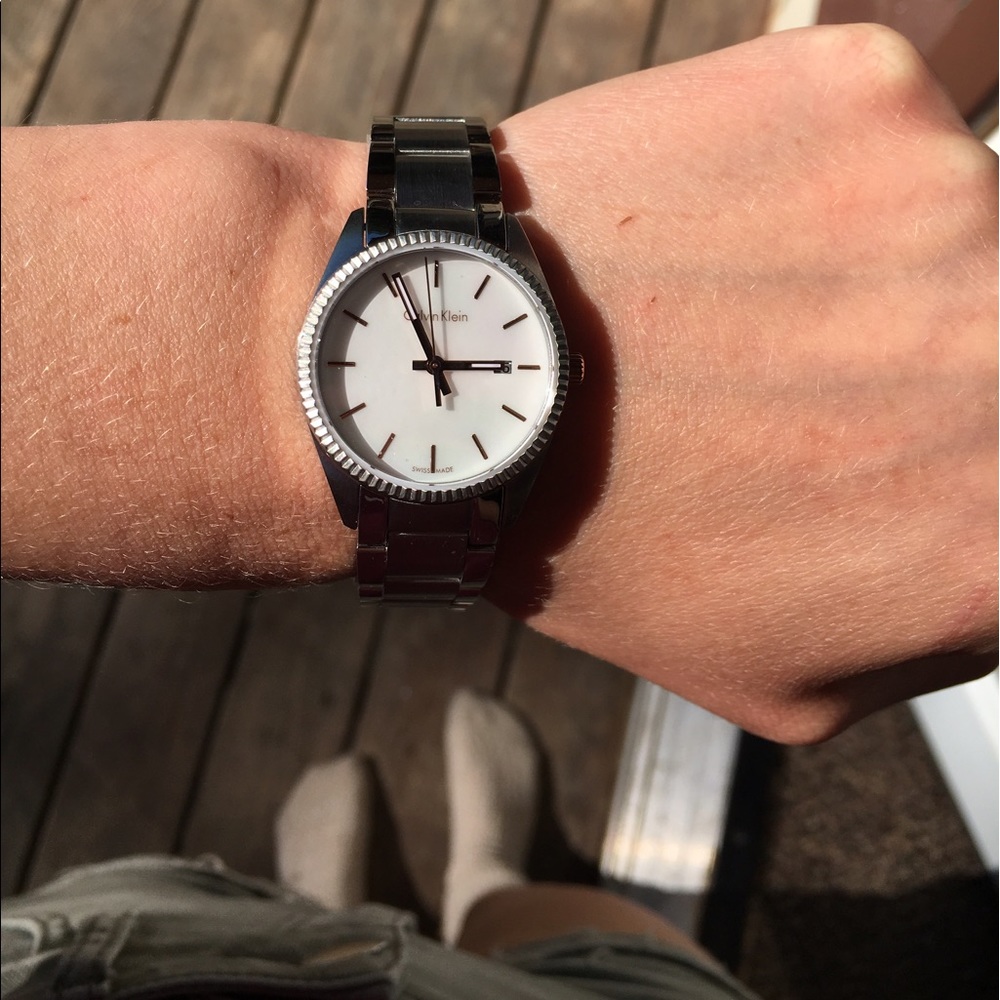 CK women's watch with subtle pearl face.