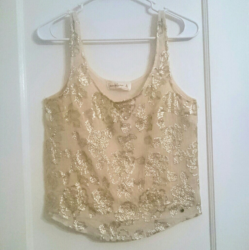 Gold sequin and cream colored top.